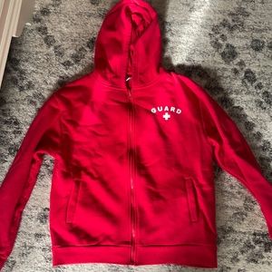 red lifeguard zip up